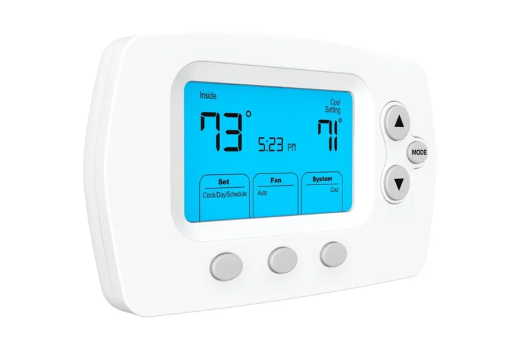 Digital thermostat showing an inside temperature of 73°F, set to 71°F for cooling. The display shows the time as 5:23 PM, with options for fan, system mode, and scheduling.